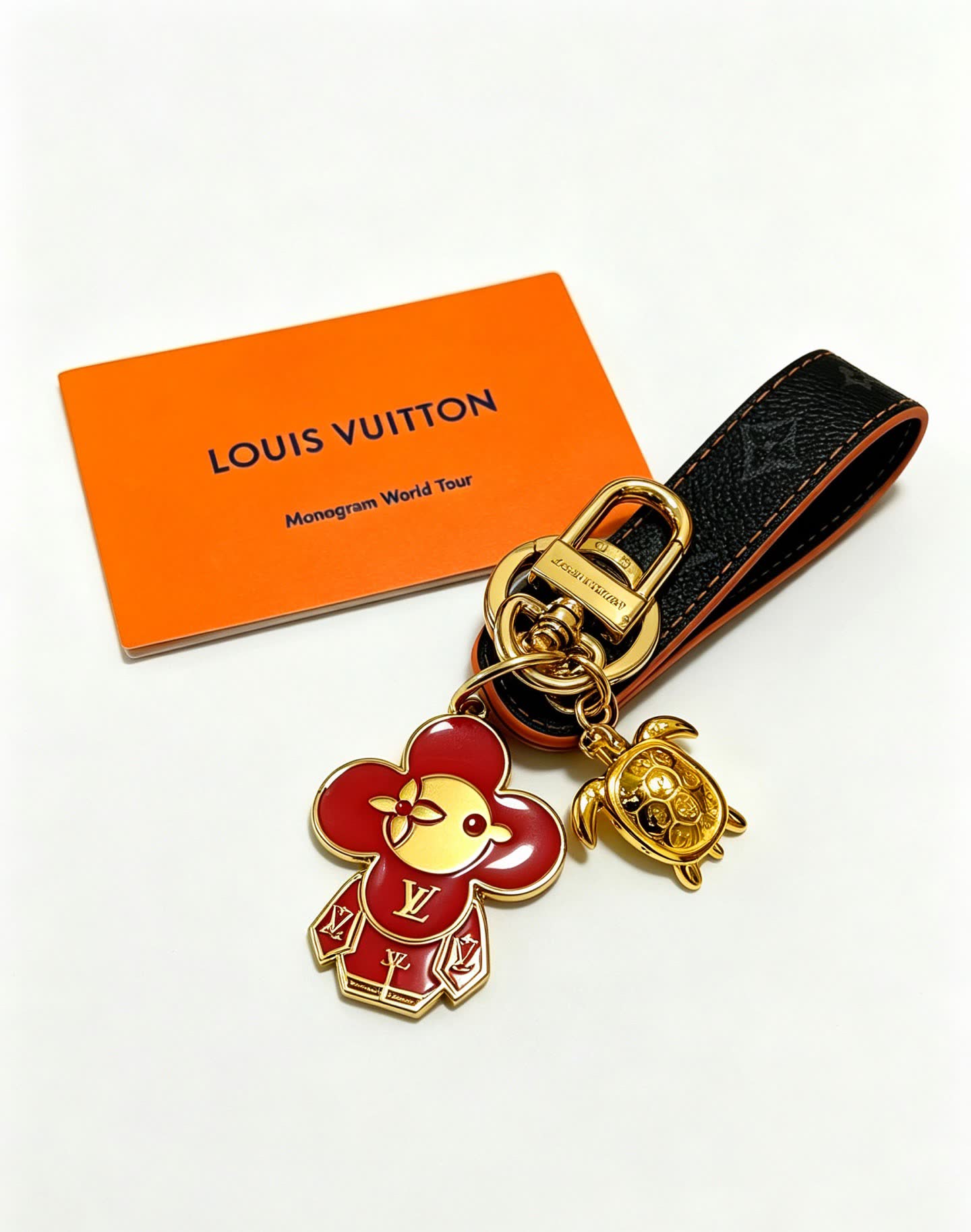 Louis Vuitton Leather Keychain with Flower and Turtle Charm